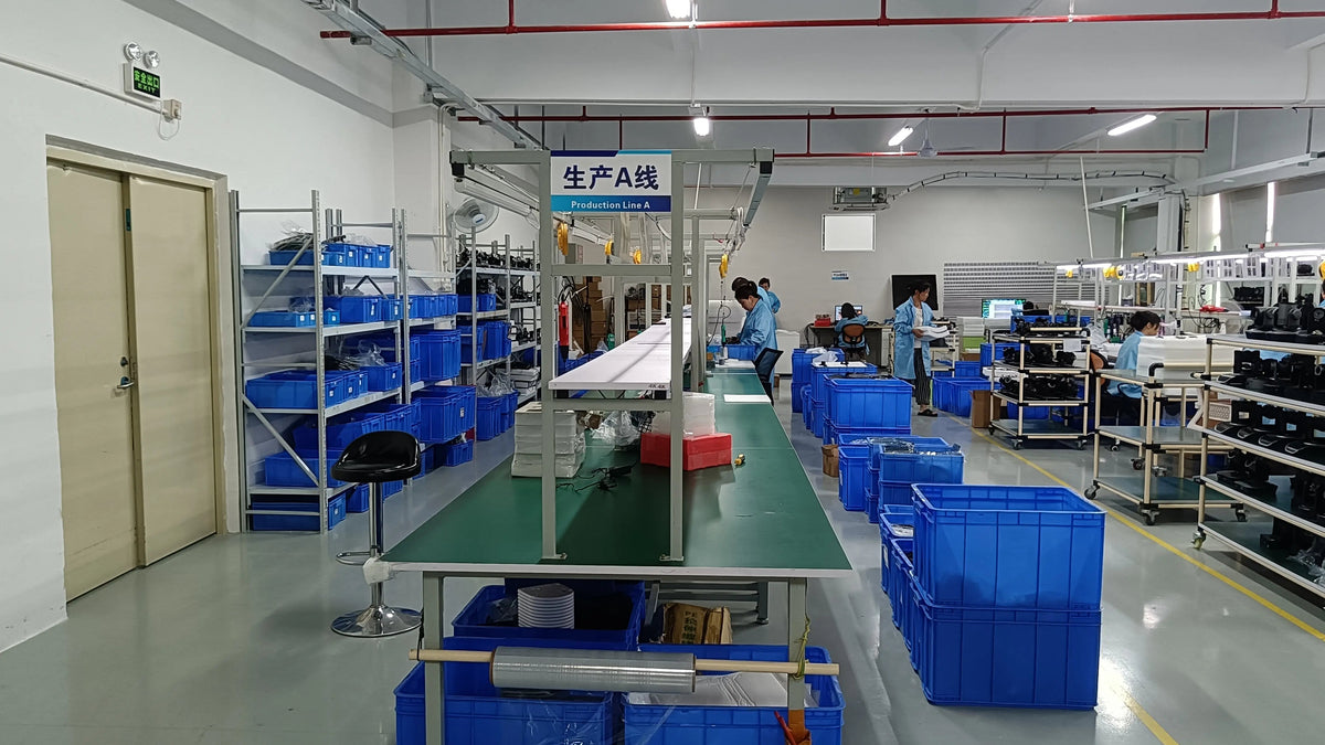 Workers assembling broadcast video equipment on Lean Production Line A inside Simitie's high-capacity Shenzhen manufacturing facility