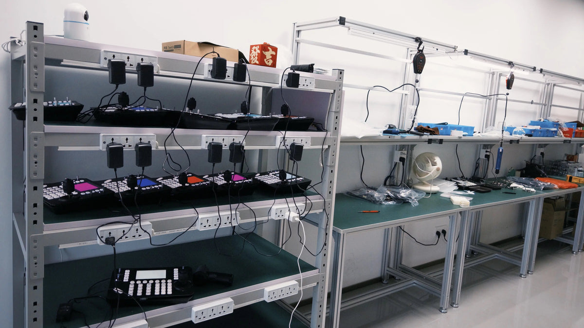 A hardware quality control rack filled with multiple PTZ camera controllers undergoing rigorous burn-in testing to minimize RMA rates