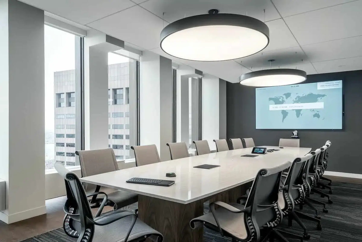 Modern executive boardroom equipped with SIMITIE premium video conferencing solutions and global communication display.